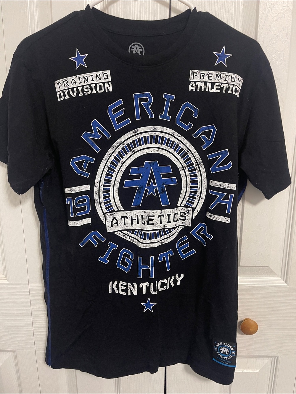 American Fighter Black Tee with Blue & White Athletic Graphic